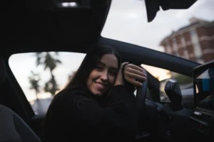 A woman driving a rental car