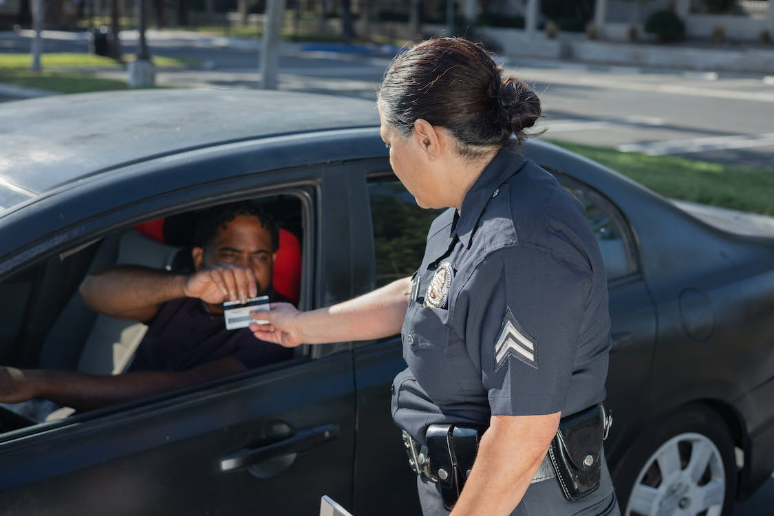 Officer checking a man’s driver’s license