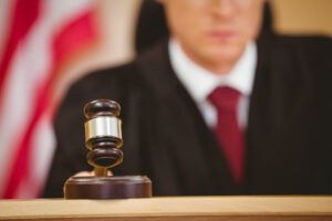 A judge hits the gavel to pass a sentence in a DUI case.
