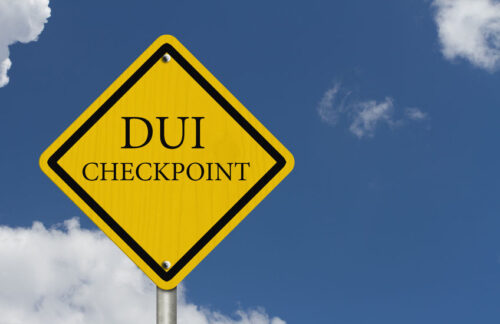 A yellow DUI checkpoint sign in Kansas.